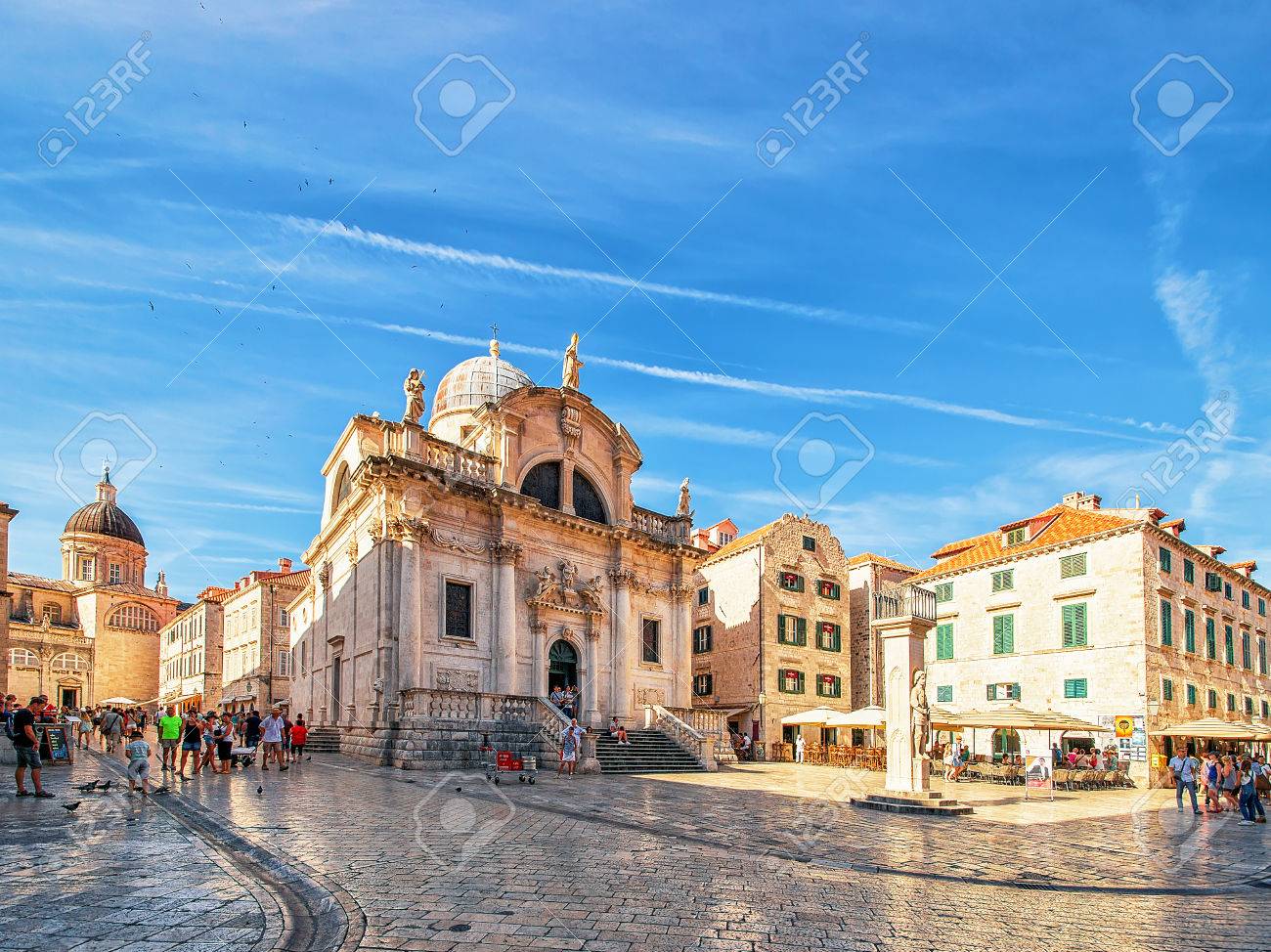 Dubrovnik, Croatia - August 20, 2016: Square at St Blaise Church and people in Stradun Street in the Old city of Dubrovnik, Croatia - 83198612 Dubrovnik, Croatia - August 20, 2016: Square at St Blaise Church and people in Stradun Street in the Old city of Dubrovnik, Croatia - 83198612