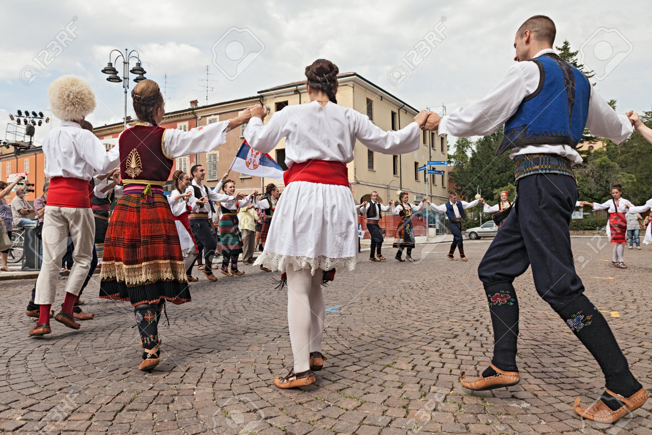 the folk dance group Folklore ensemble Saint George s Church from Belgrade, Serbia, performs popular circle dances in traditional dress at the International Folklore Festival of Russi, on August 3, 2014 in Russi, RA, Italy - 30948437 the folk dance group Folklore ensemble Saint George s Church from Belgrade, Serbia, performs popular circle dances in traditional dress at the International Folklore Festival of Russi, on August 3, 2014 in Russi, RA, Italy - 30948437