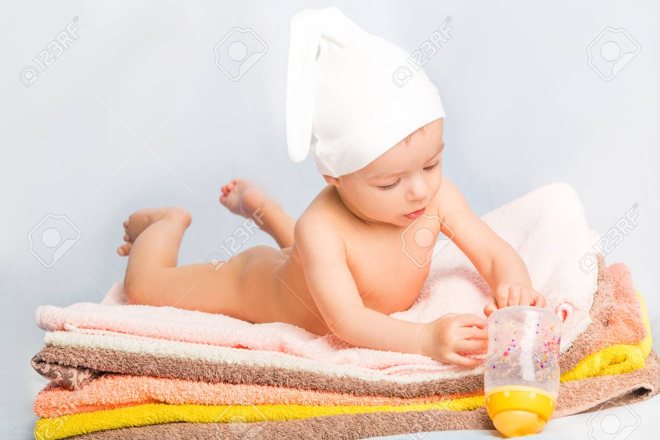 baby holding towel
