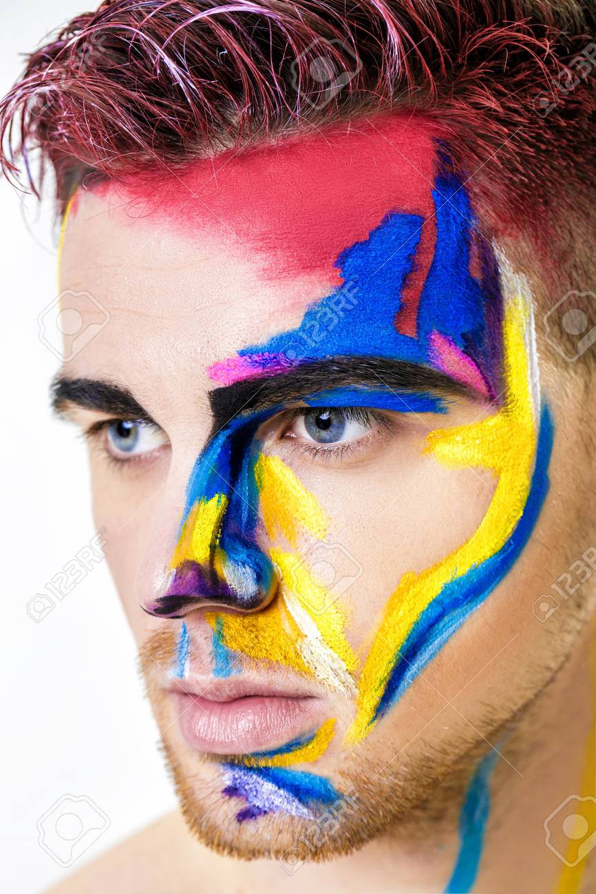 Portrait Of Young Attractive Man With Colored Face Paint On White  Background. Professional Makeup Fashion. Ffantasy Art Makeup Stock Photo,  Picture and Royalty Free Image. Image 77050725.