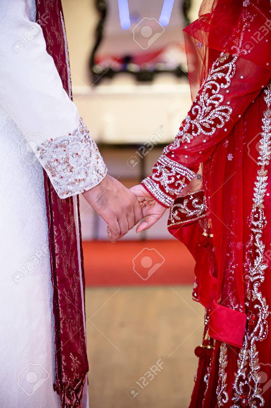 Bride And Groom Holding Hands Indian Stock Photo Picture And
