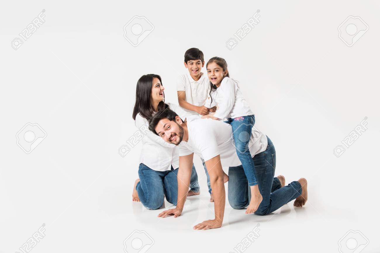 happy mad ride on father's back. Indian small girl sitting on Dad's back while mother and brother laughing. selective focus - 117728665 happy mad ride on father's back. Indian small girl sitting on Dad's back while mother and brother laughing. selective focus - 117728665