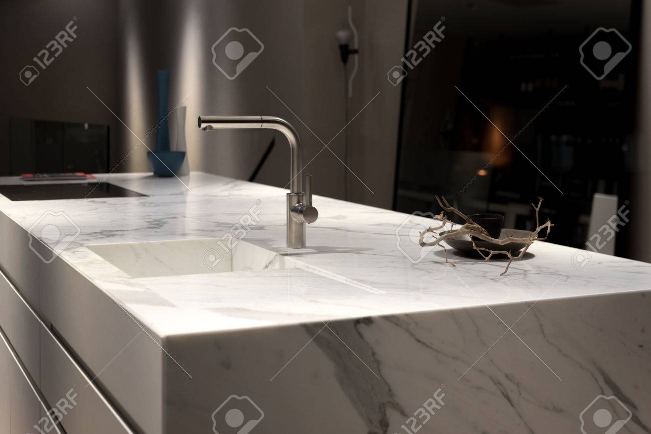 Stylish Solid White Marble Kitchen Counter With Dark Cupboards Stylish Solid White Marble Kitchen Counter With Dark Cupboards