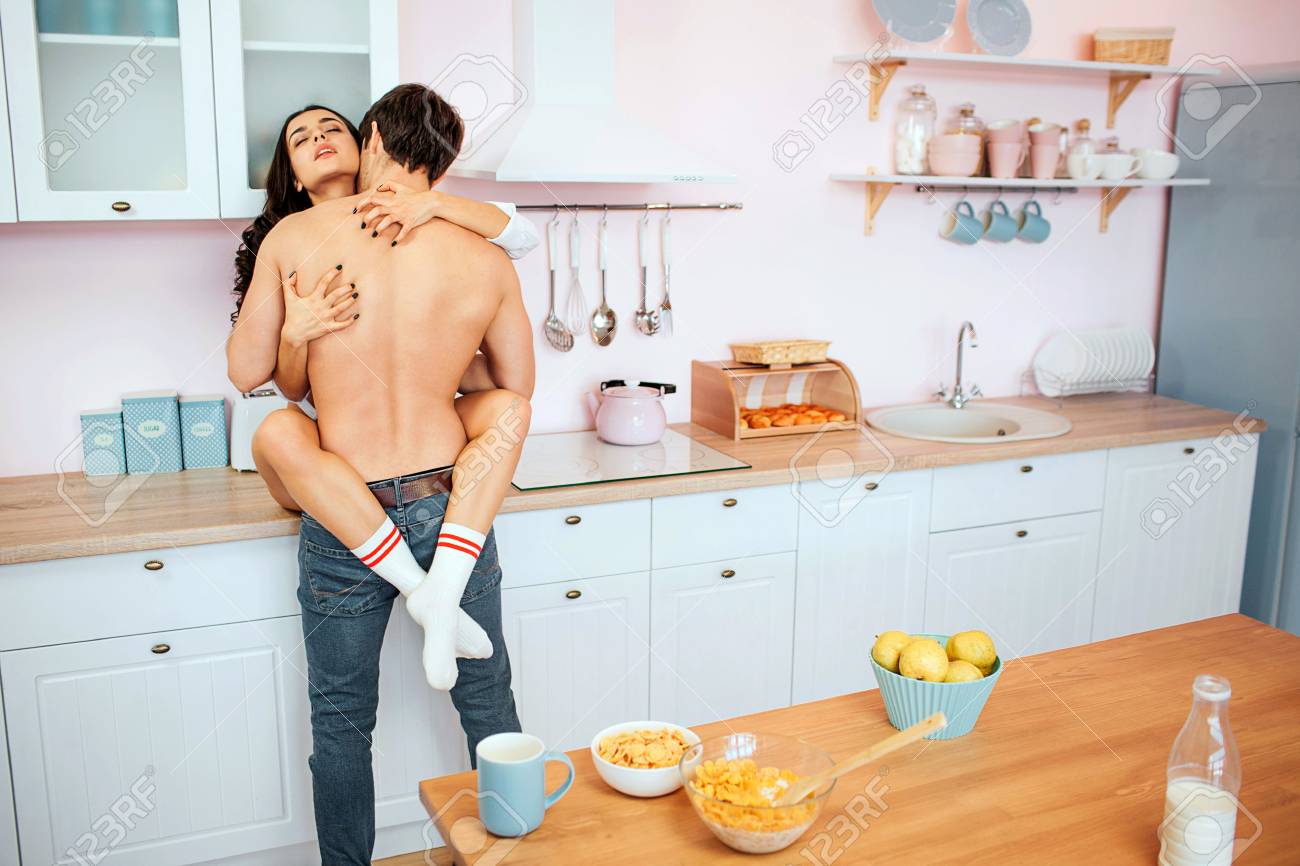 Young Hot Couple Having Sex On Kitchen Cabineet She Sit There
