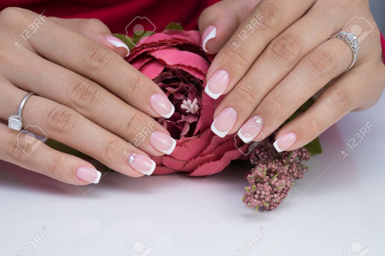 Natural nails with gel polish applied. Ideal manicure and women's hands. - 92334552 Natural nails with gel polish applied. Ideal manicure and women's hands. - 92334552