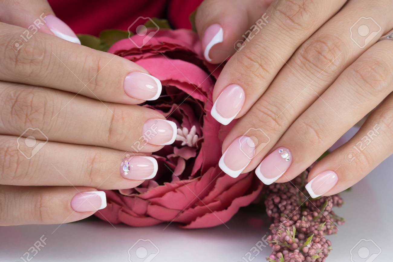 Natural nails with gel polish applied. Ideal manicure and women's hands. - 92401756 Natural nails with gel polish applied. Ideal manicure and women's hands. - 92401756
