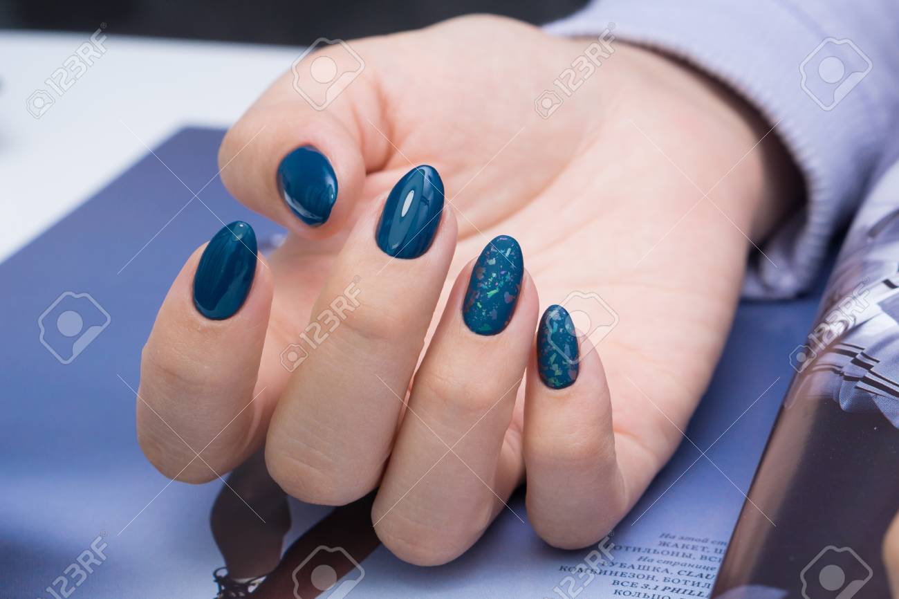 Beautiful natural nails and attractive manicure on women hands. - 92881671 Beautiful natural nails and attractive manicure on women hands. - 92881671