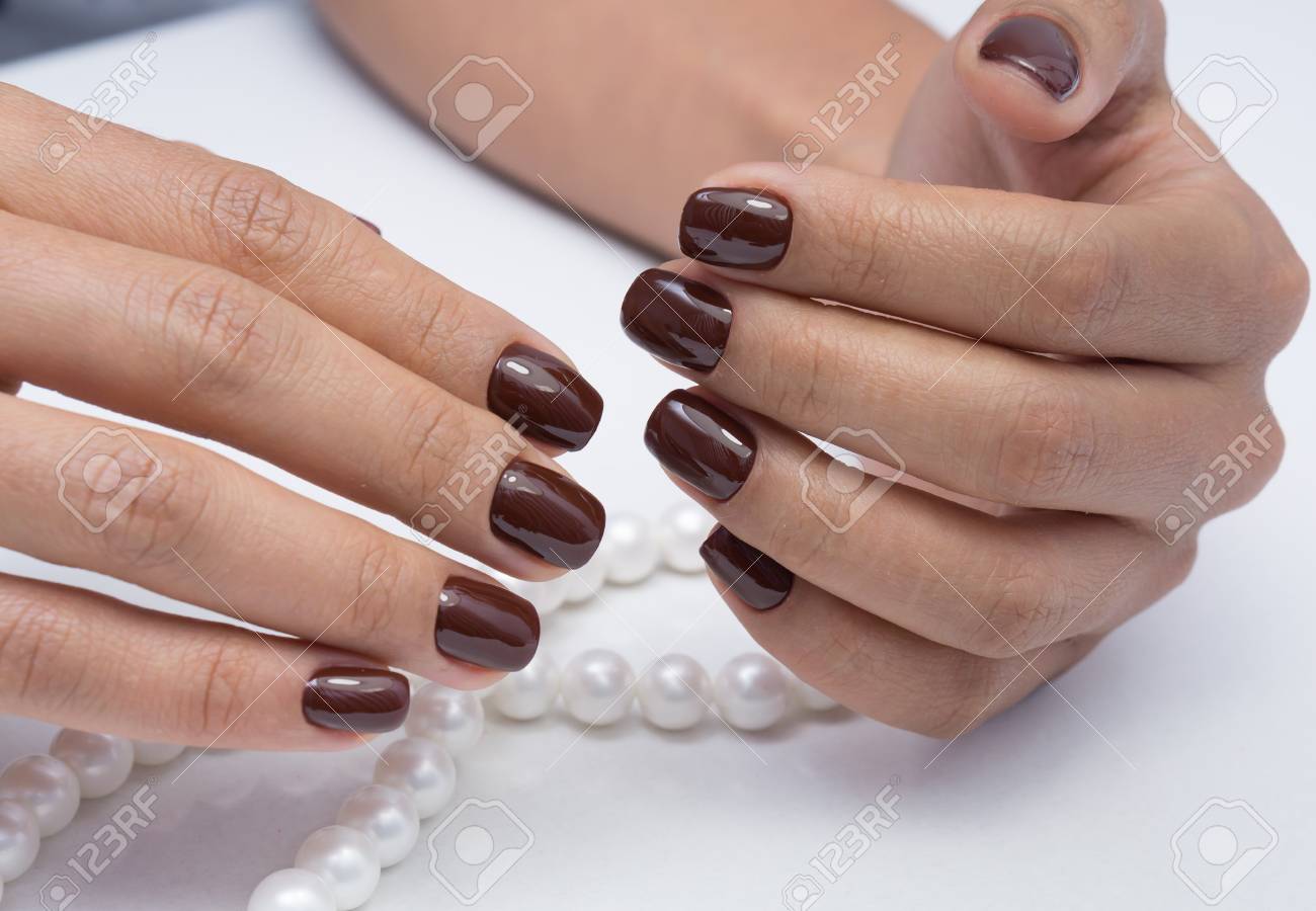 Beautiful natural nails and attractive manicure on women hands. - 92881684 Beautiful natural nails and attractive manicure on women hands. - 92881684
