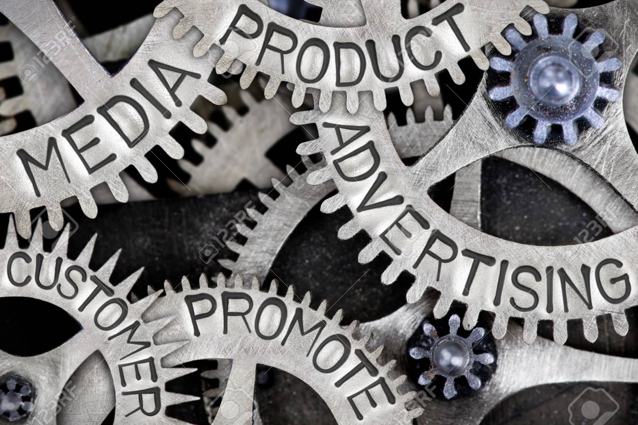 macro photo of tooth wheel mechanism with advertising media words to promote a product