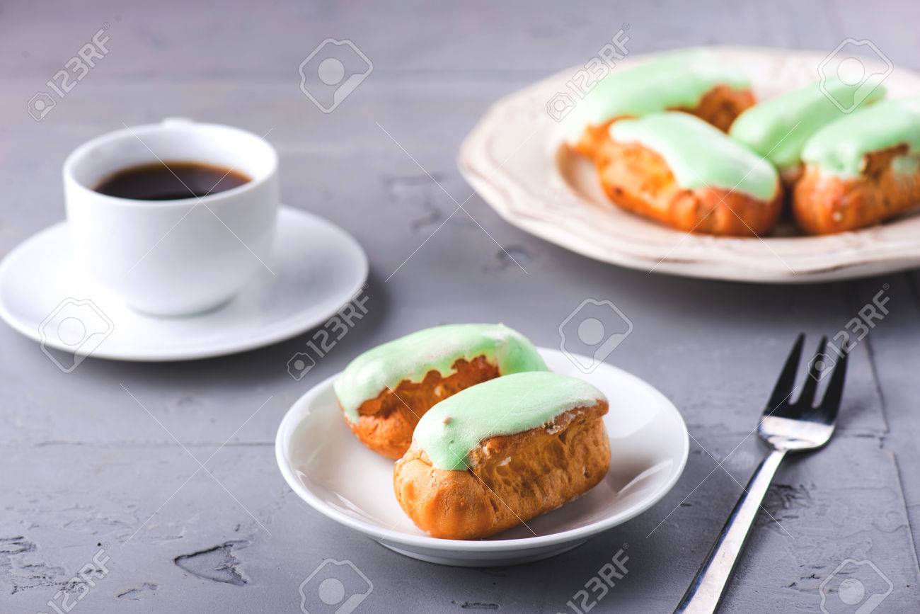 Breakfast with mint eclairs and coffee cup - 58050347 Breakfast with mint eclairs and coffee cup - 58050347