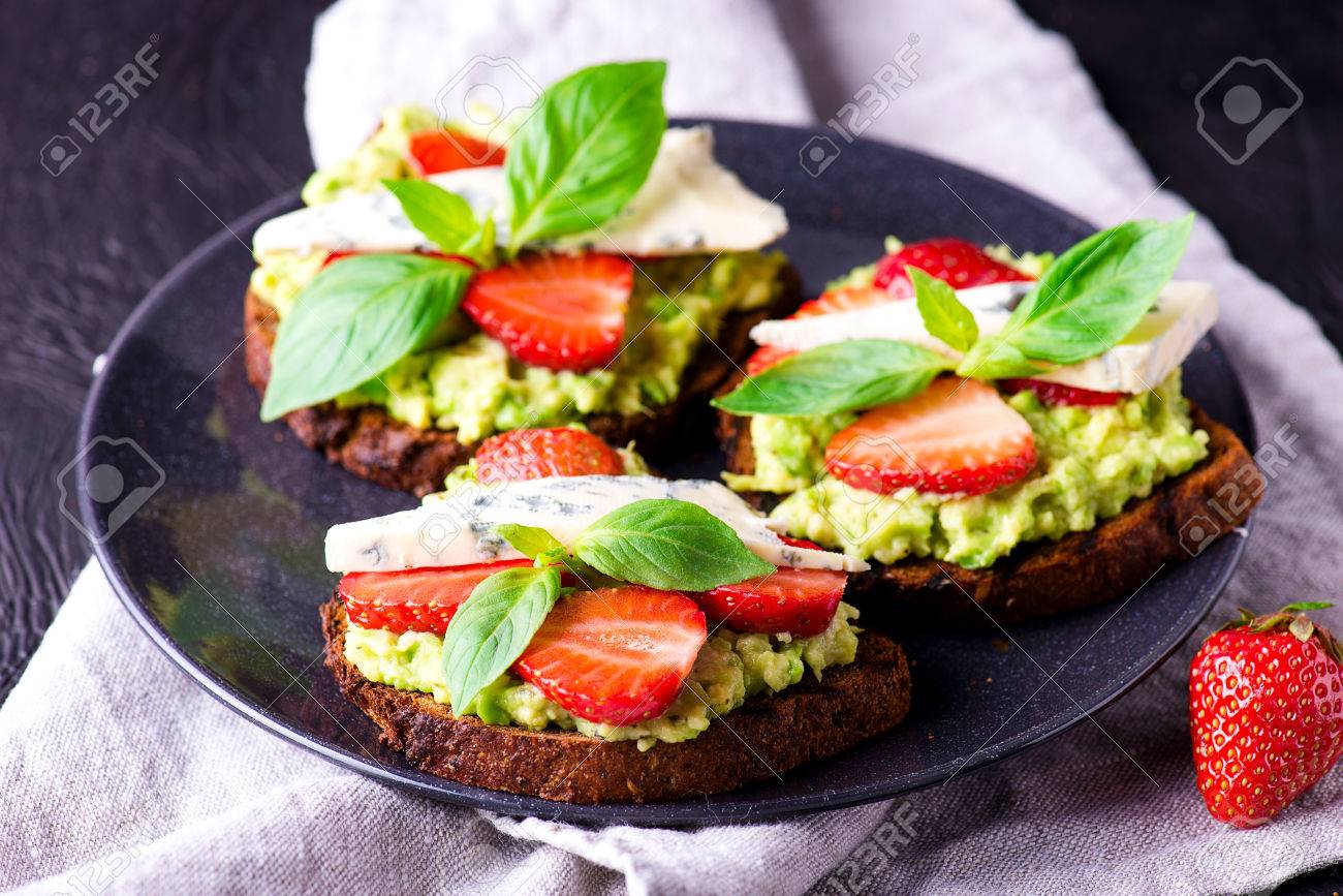 Fresh toast with strawberry on dark plate - 58050369 Fresh toast with strawberry on dark plate - 58050369