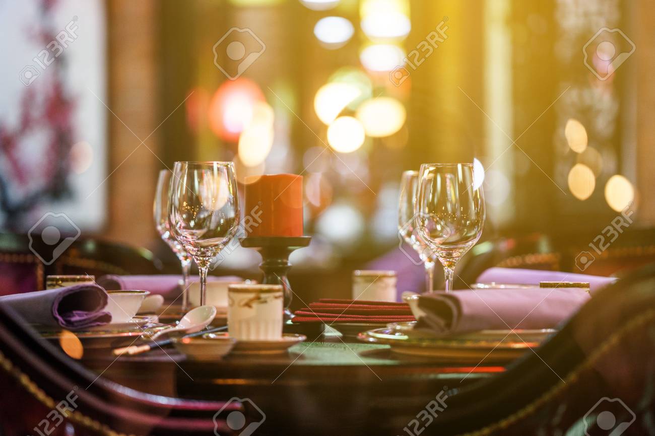 Table For Event With Flower Vases Towels And Wine Glasses Stock