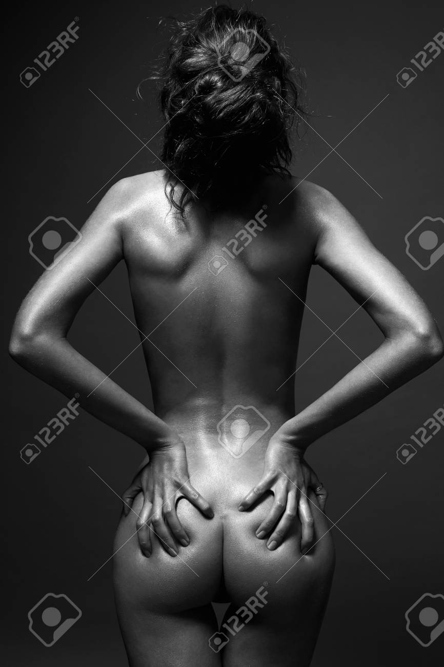 Nude Girl. Naked Woman Back In Dark. Beautiful Female Spine And Booty Stock  Photo, Picture and Royalty Free Image. Image 107395302.