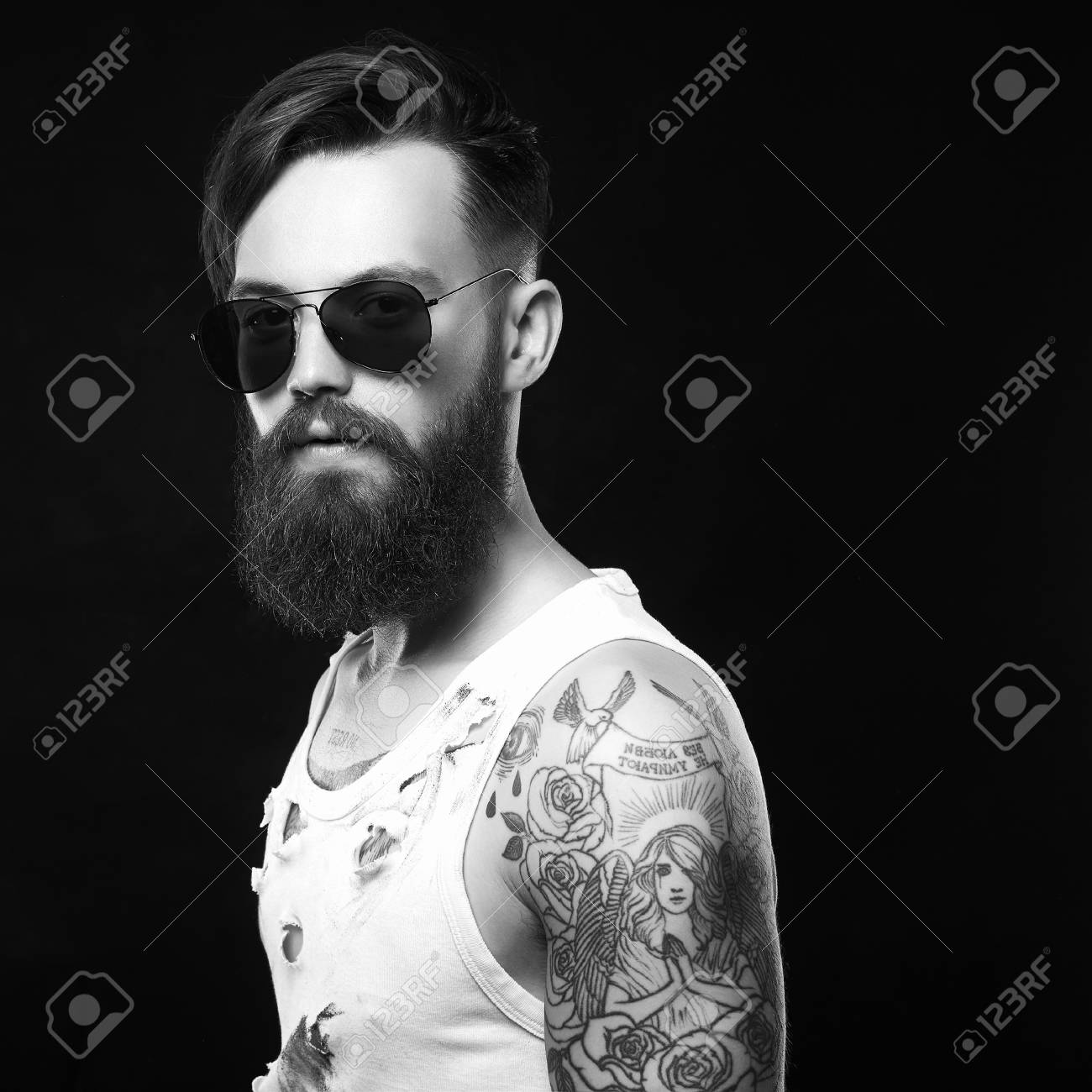 Handsome Man In Sunglasses Bearded Hipster In Vintage Torn Dirty