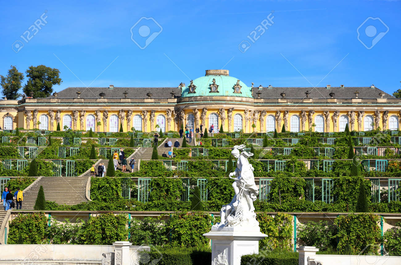 Potsdam, Germany - September 18, 2020: Visiting the royal palace und park Sanssouci in Potsdam on a sunny day in September. View on the the south facing garden façade. - 164924777 Potsdam, Germany - September 18, 2020: Visiting the royal palace und park Sanssouci in Potsdam on a sunny day in September. View on the the south facing garden façade. - 164924777