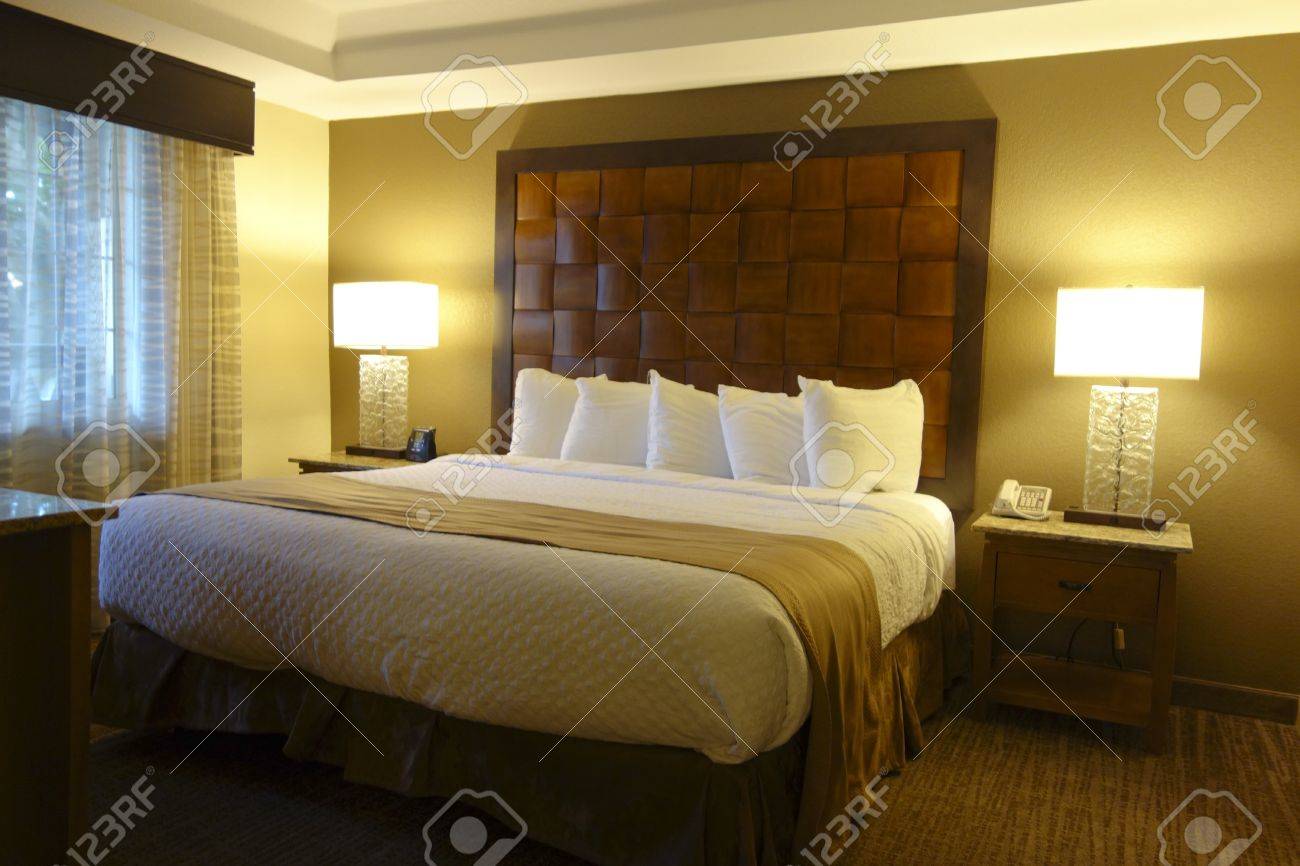 Interior Of Modern Luxury Hotel Bedroom With Nightstands And