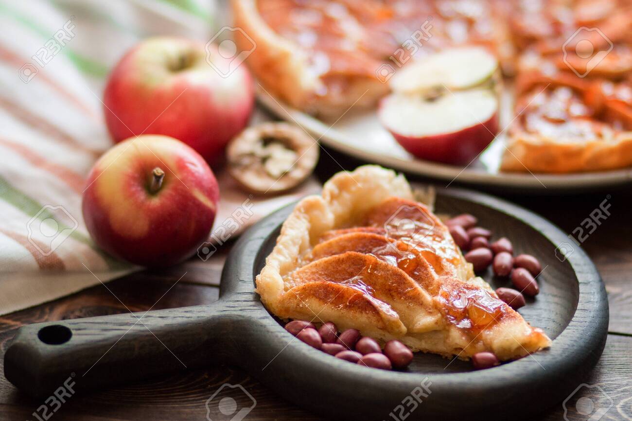 A Piece Of Apple Pie With Roasted Peanuts Fresh Apple And Caramel Stock Photo Picture And Royalty Free Image Image 132597146