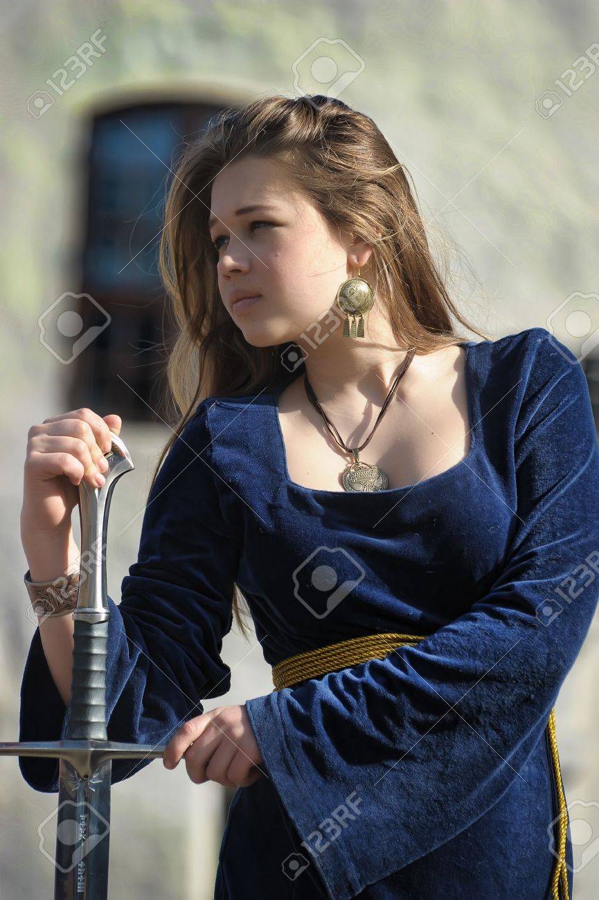 Young Girl In Medieval Dress With Sword Stock Photo, Picture and Royalty  Free Image. Image 14329176., image size:865x1300