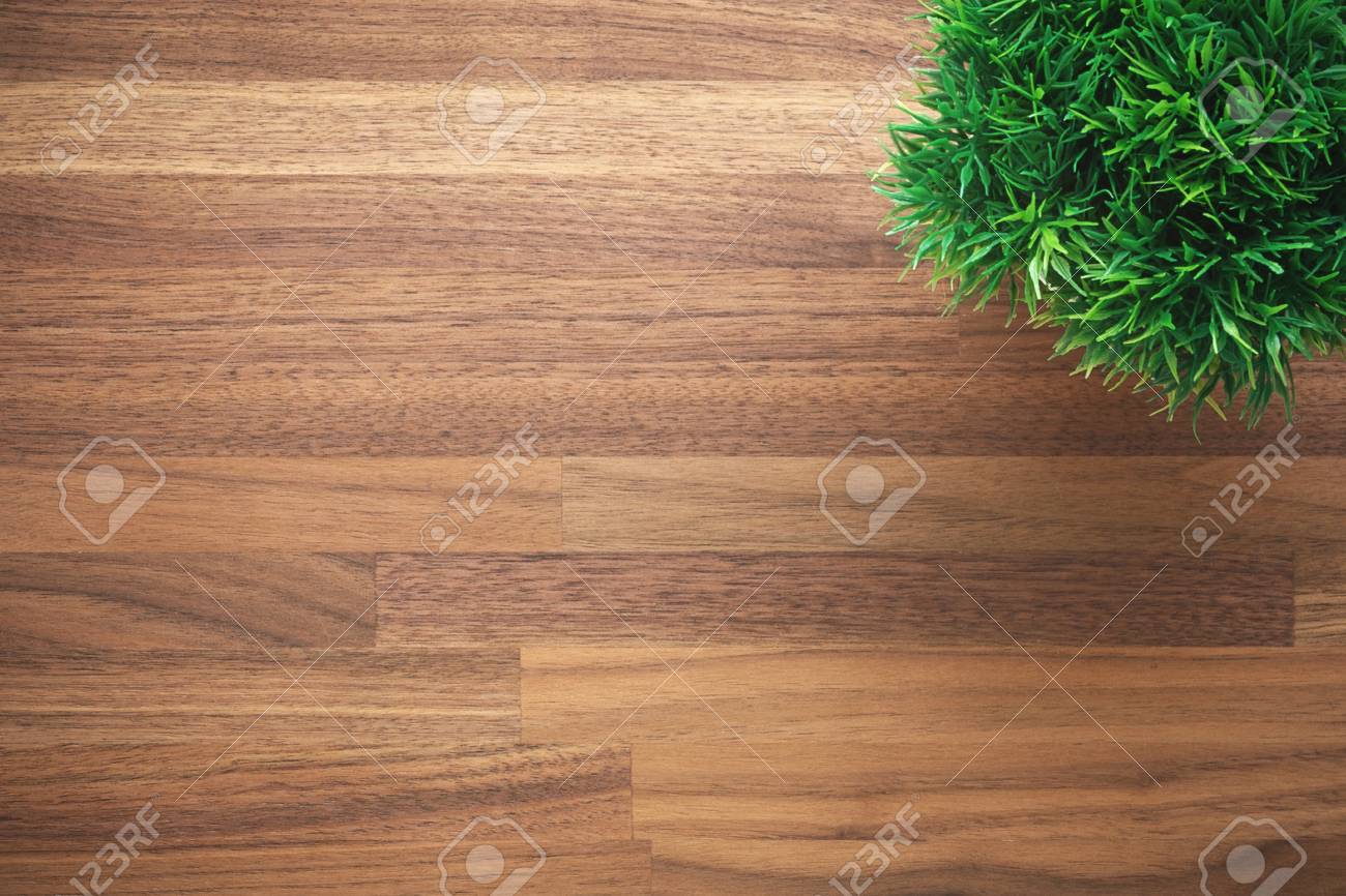 Wooden Office Desk Background With Artificial Green Plant Stock Photo,  Picture and Royalty Free Image. Image 76628497., image size:1300x866