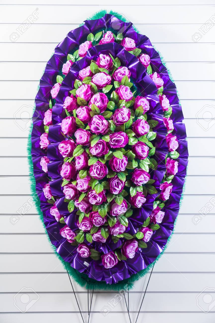 Luxury Funeral Wreath With Pink And Purple Flowers On A White