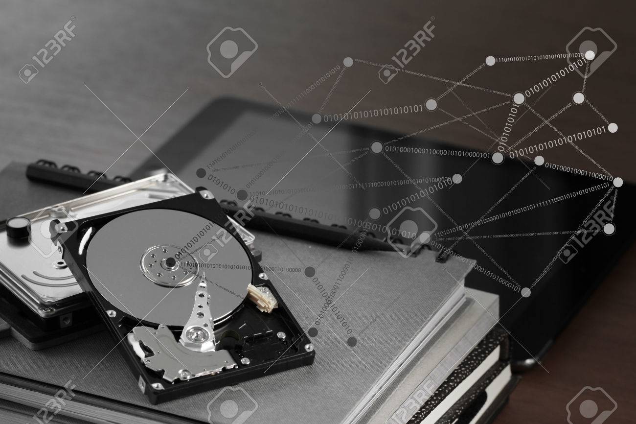Close Up Of Open Computer Hard Disk Drive With Social Network Diagram On Desk And Notebook Stock Photo Picture And Royalty Free Image Image 38970923
