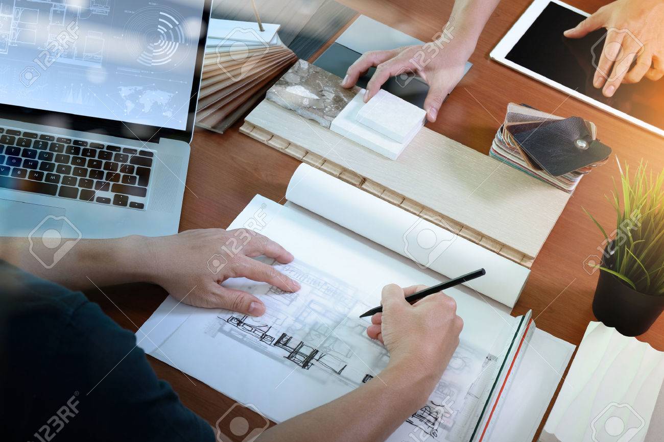 top view of two colleagues interior designers discussing data with blank screen new modern computer laptop and pro digital tablet with sample material on wooden desk as concept - 50068414 top view of two colleagues interior designers discussing data with blank screen new modern computer laptop and pro digital tablet with sample material on wooden desk as concept - 50068414