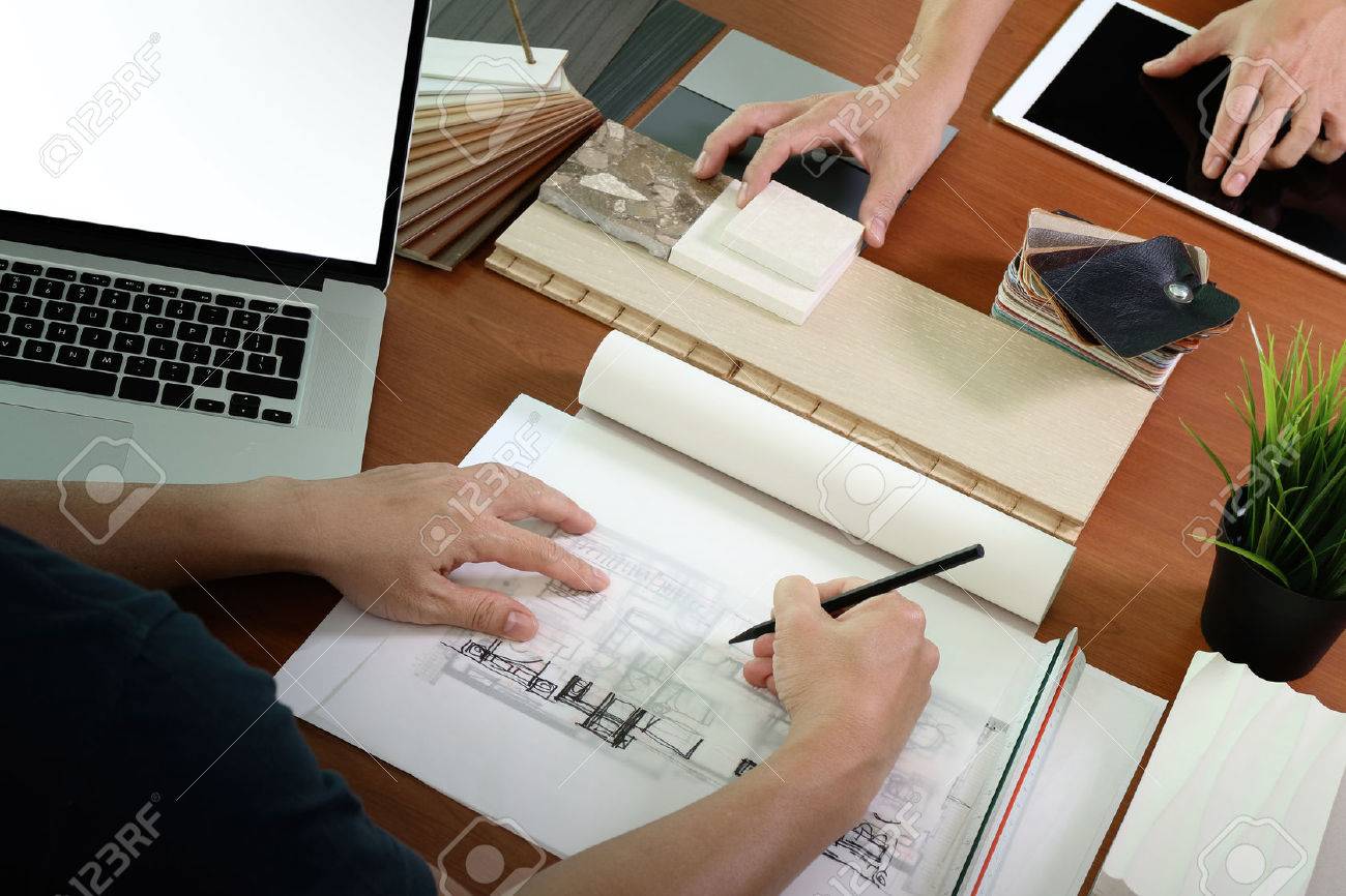 top view of two colleagues interior designers discussing data with blank screen new modern computer laptop and pro digital tablet with sample material on wooden desk as concept - 51496615 top view of two colleagues interior designers discussing data with blank screen new modern computer laptop and pro digital tablet with sample material on wooden desk as concept - 51496615