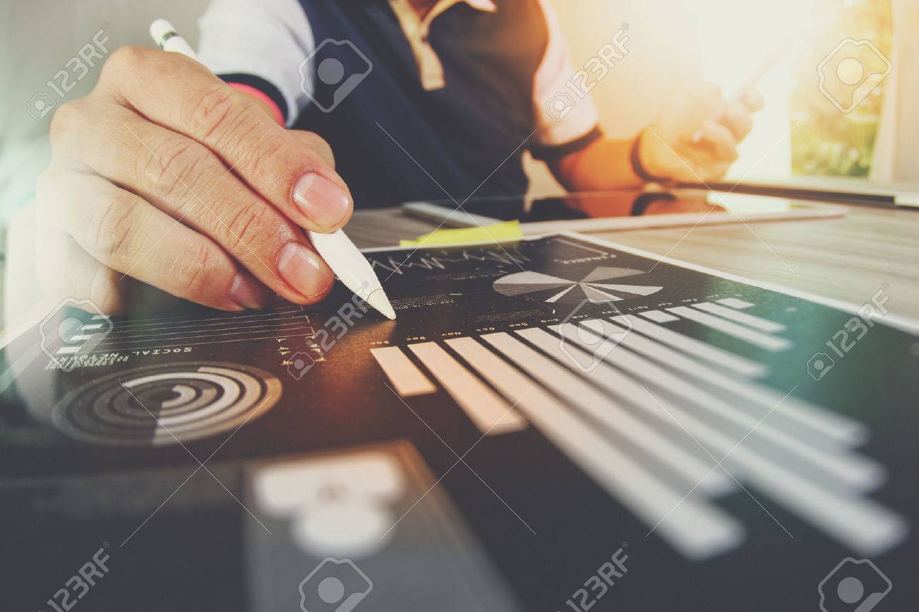 business documents on office table with smart phone and digital tablet and graph business with social network diagram and man working in the background - 53604078 business documents on office table with smart phone and digital tablet and graph business with social network diagram and man working in the background - 53604078