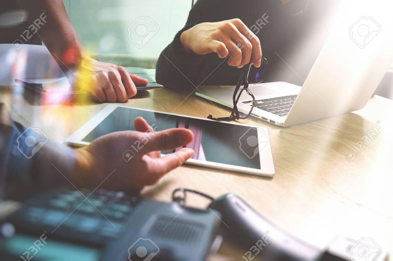 Business team meeting present. Photo professional investor working with new startup project. Finance managers meeting.Digital tablet laptop computer design smart phone using.Sun flare effect - 65309463 Business team meeting present. Photo professional investor working with new startup project. Finance managers meeting.Digital tablet laptop computer design smart phone using.Sun flare effect - 65309463