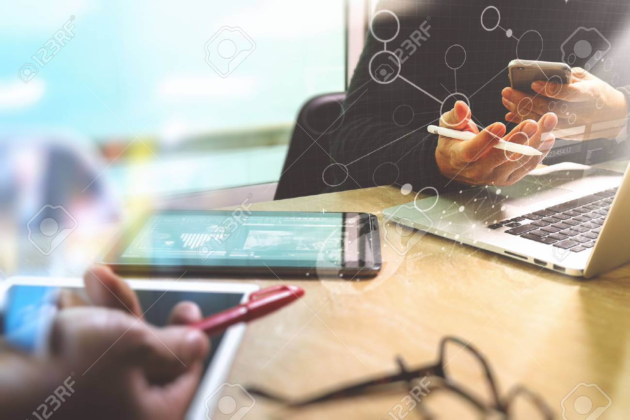 Photo website graphic designer hand meeting team with new project modern studio.Modern laptop digital tablet smart phone on marble table.Books papers documents, sun flare effect - 68505261 Photo website graphic designer hand meeting team with new project modern studio.Modern laptop digital tablet smart phone on marble table.Books papers documents, sun flare effect - 68505261