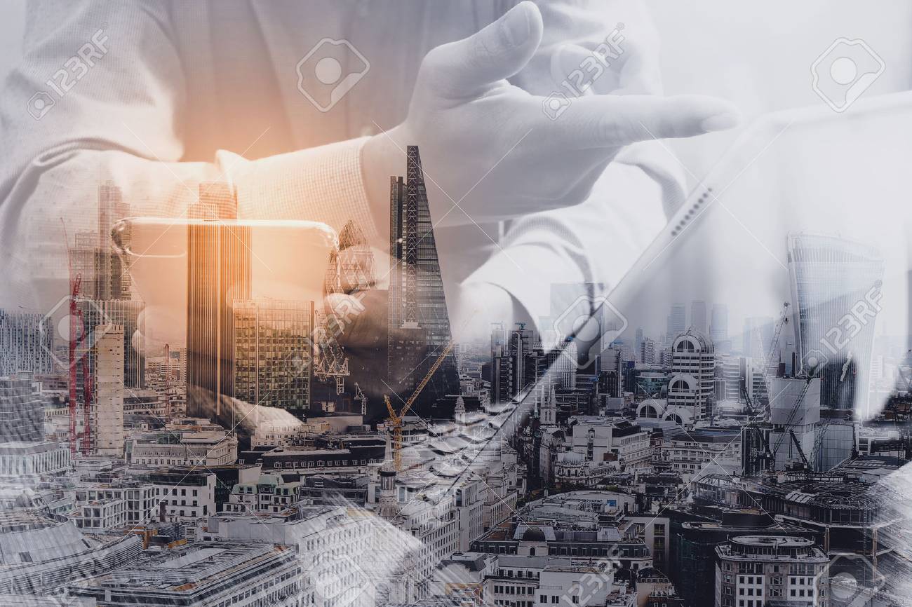 Double exposure of success businessman using smart phone,digital tablet docking smart keyboard with London building,city,omnichannel - 68573863 Double exposure of success businessman using smart phone,digital tablet docking smart keyboard with London building,city,omnichannel - 68573863