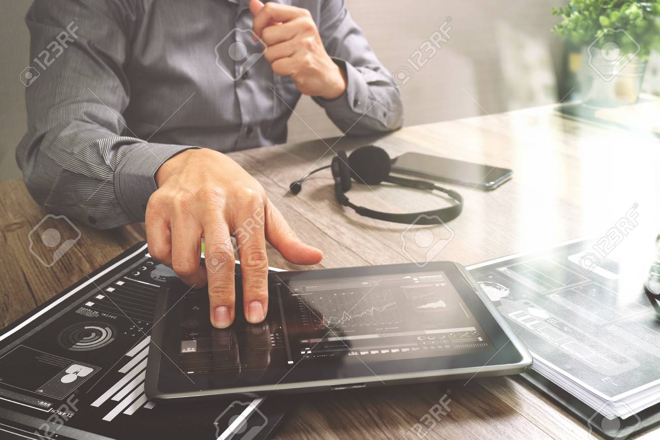 Businessman hand using VOIP headset with digital tablet computer,document,concept communication, it support, call center and customer service help desk,filter effect - 72175426 Businessman hand using VOIP headset with digital tablet computer,document,concept communication, it support, call center and customer service help desk,filter effect - 72175426