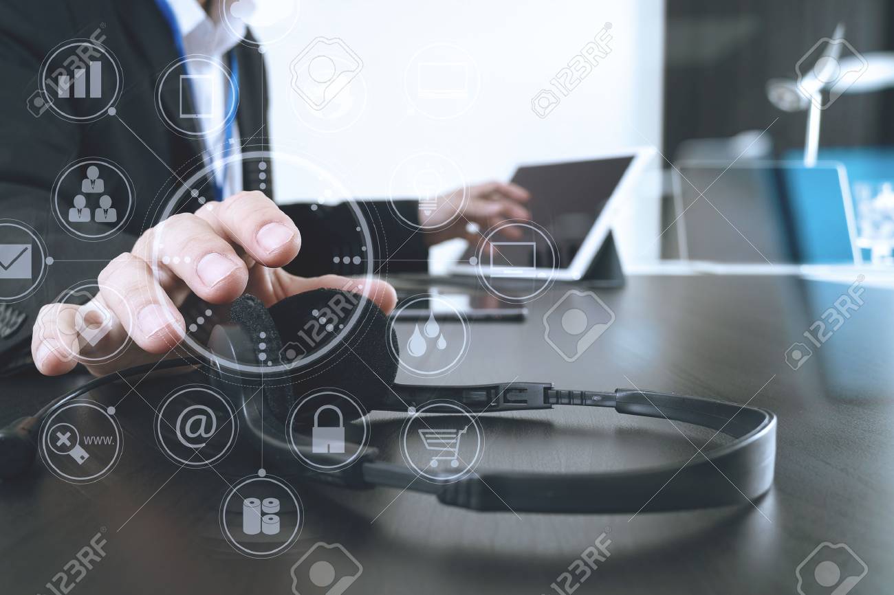 Man using VOIP headset with digital tablet and laptop computer as concept communication,it support,call center and customer service help desk with virtual icon diagram - 76802840 Man using VOIP headset with digital tablet and laptop computer as concept communication,it support,call center and customer service help desk with virtual icon diagram - 76802840