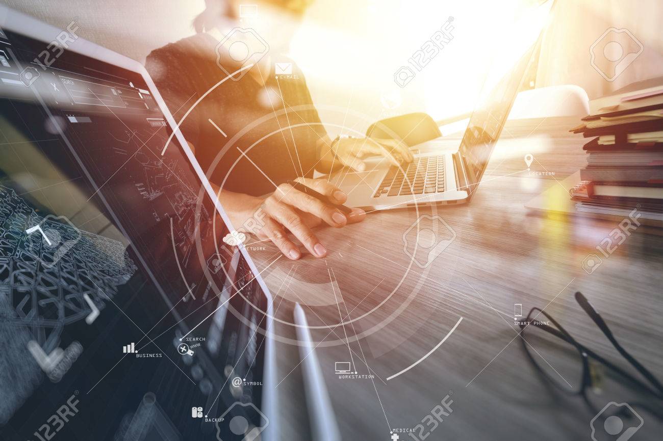 businessman working with mobile phone and digital tablet and laptop computer on wooden desk in modern office with virtual icon diagram - 76603415 businessman working with mobile phone and digital tablet and laptop computer on wooden desk in modern office with virtual icon diagram - 76603415