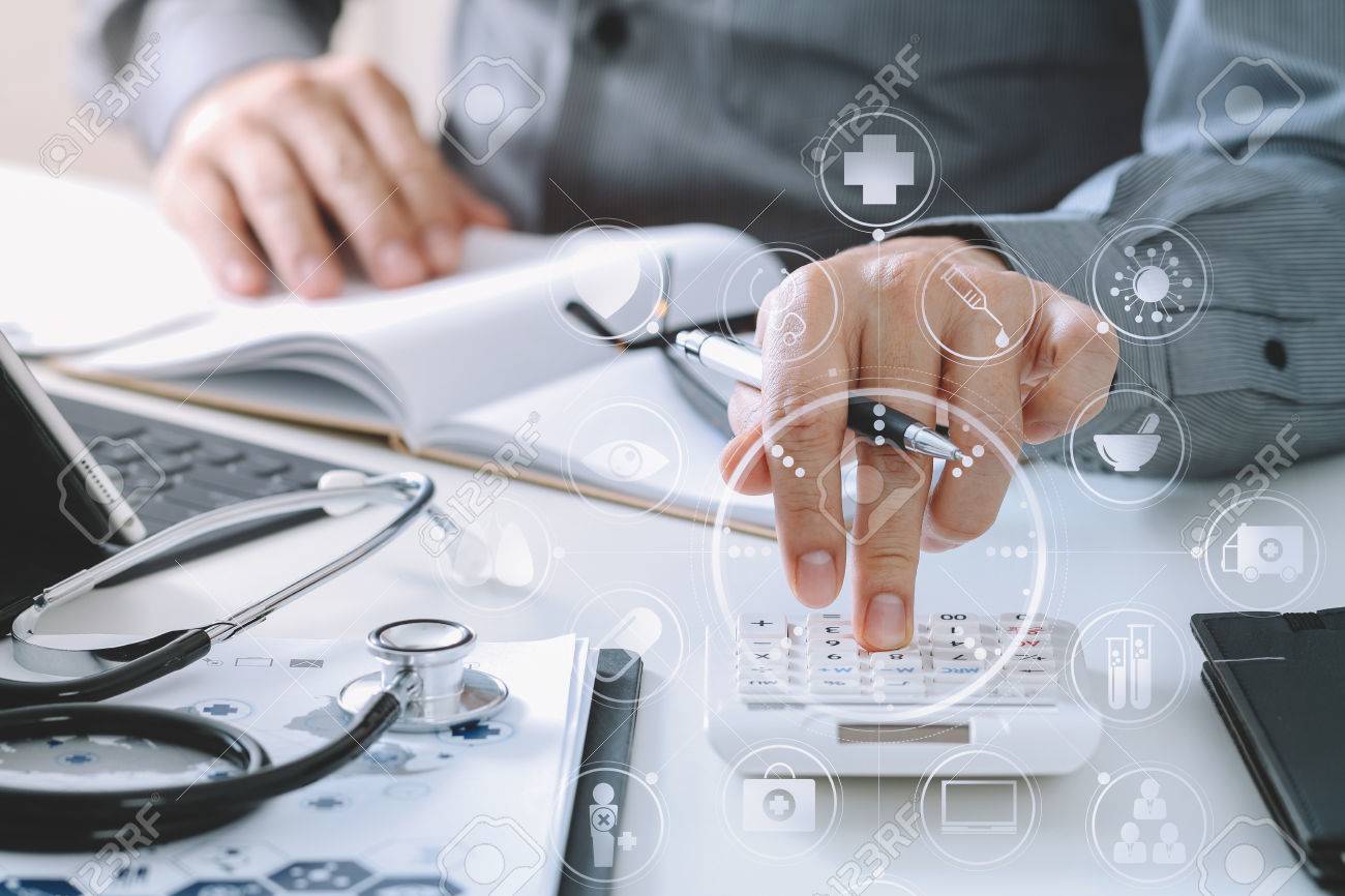 Healthcare costs and fees concept.Hand of smart doctor used a calculator for medical costs in modern hospital with VR icon diagram - 80116541 Healthcare costs and fees concept.Hand of smart doctor used a calculator for medical costs in modern hospital with VR icon diagram - 80116541