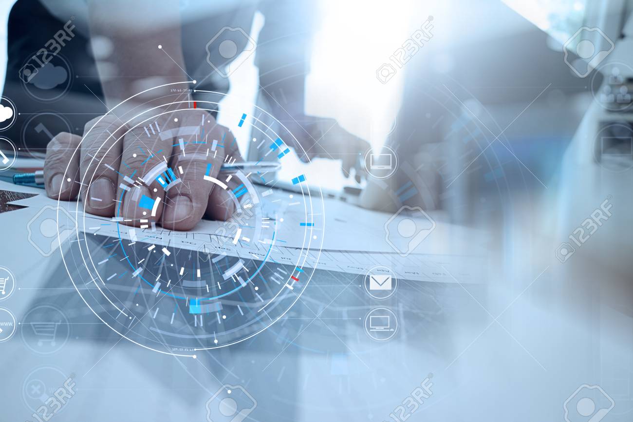 Hands of businessman using mobile phone in modern office with laptop and digital tablet computer in finance team meeting with VR icon diagram - 92775735 Hands of businessman using mobile phone in modern office with laptop and digital tablet computer in finance team meeting with VR icon diagram - 92775735