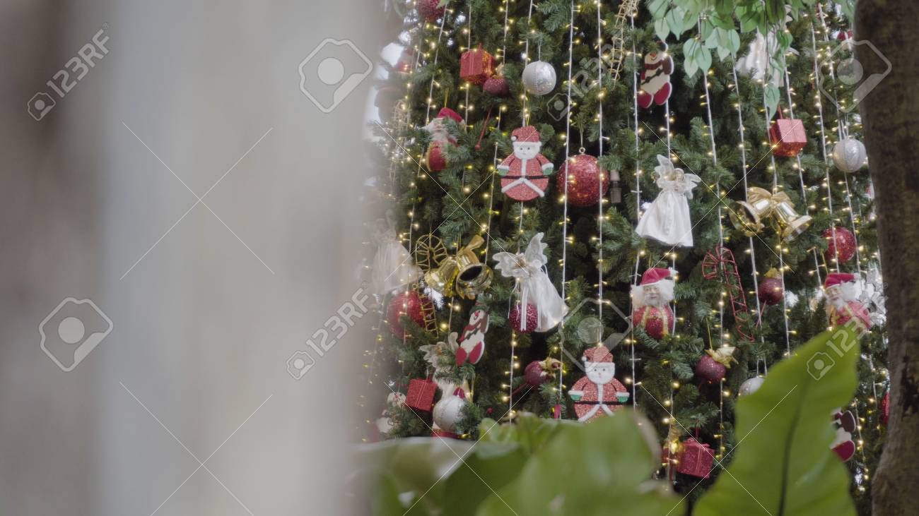 Gimbal Shot Of Ornaments On Christmas Tree With Decorative Light And Front Gimbal Shot Of Ornaments On Christmas Tree With Decorative Light And Front