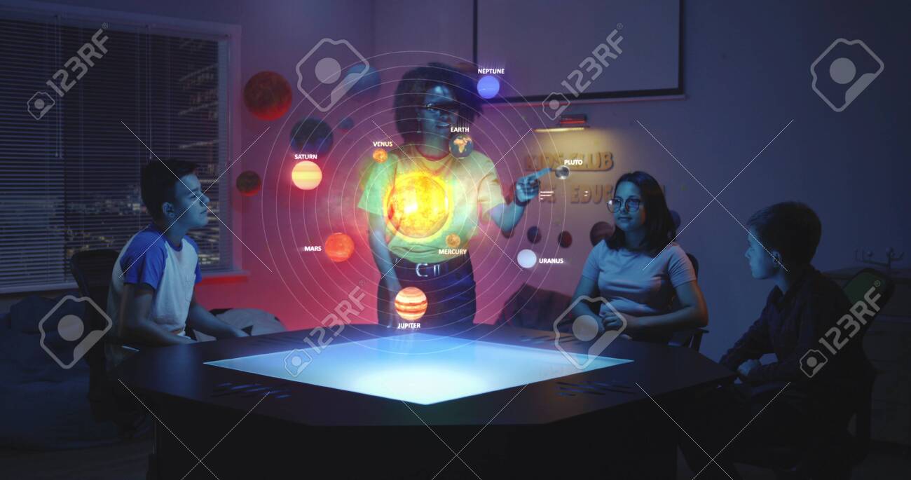 Medium Shot Of A Teacher And Her Students Looking At A Solar