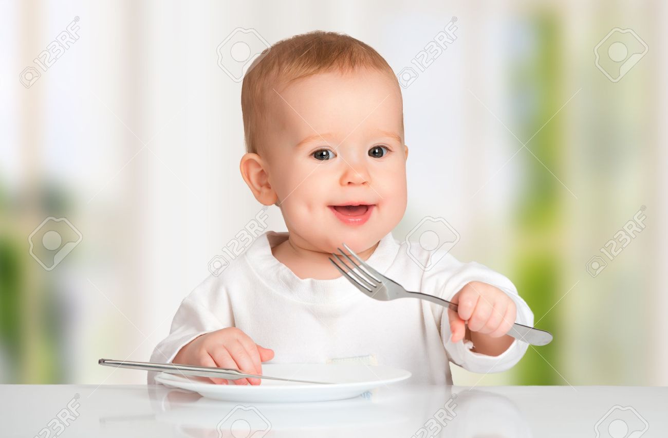 Funny Happy Baby With A Knife And Fork 