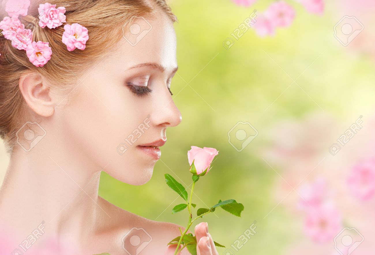 36801219-beauty-face-of-the-young-beautiful-woman-with-pink-flowers-in-her-hair.jpg