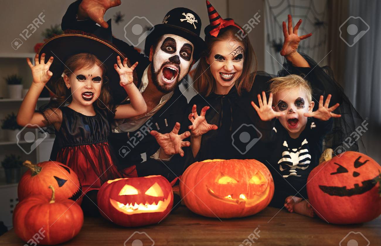 happy family mother father and children in costumes and makeup on a celebration of Halloween - 86199806 happy family mother father and children in costumes and makeup on a celebration of Halloween - 86199806