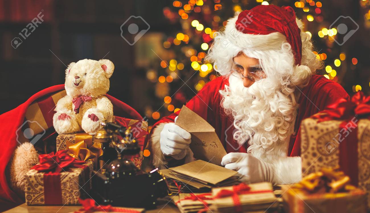 santa claus at his desk with letters and christmas presents stock photo 89291560 - Santa Claus With Presents santa claus at his desk with letters and christmas presents stock photo 89291560 - Santa Claus With Presents