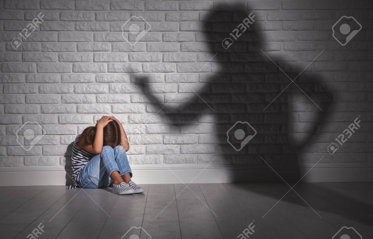 domestic violence. angry mother scolds frightened daughter sitting on floor - 93931136 domestic violence. angry mother scolds frightened daughter sitting on floor - 93931136