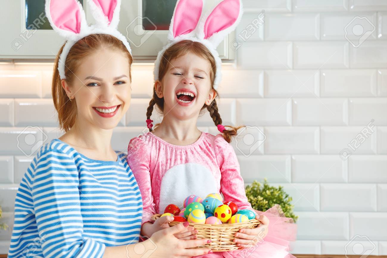 Happy easter! family mother and child daughter with ears hare getting ready for holiday - 97650066 Happy easter! family mother and child daughter with ears hare getting ready for holiday - 97650066