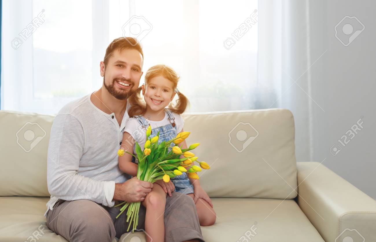 father and child daughter with a bouquet of flowers at home - 97622308 father and child daughter with a bouquet of flowers at home - 97622308