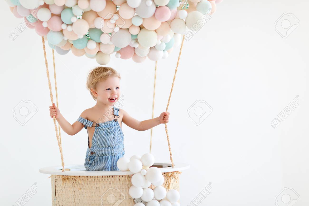 cute happy baby boy in a fairy magic hot air balloon - 100274902 cute happy baby boy in a fairy magic hot air balloon - 100274902
