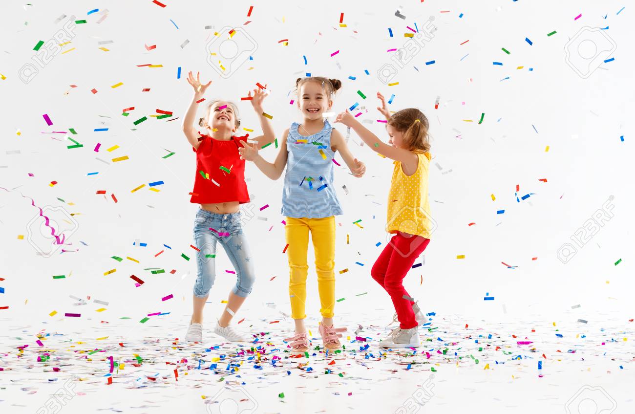 happy children on holidays have fun and jumping in multicolored confetti on white background - 100277506 happy children on holidays have fun and jumping in multicolored confetti on white background - 100277506