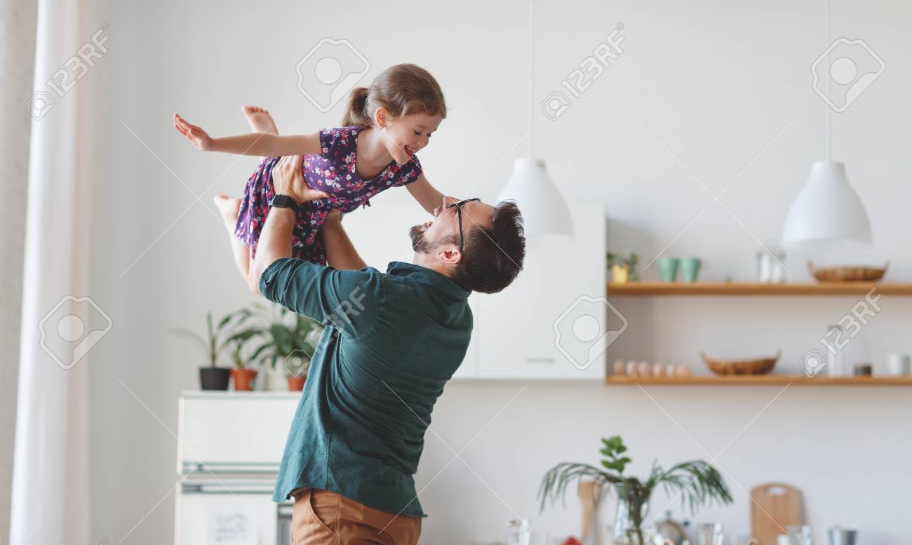 Father's day. Happy family daughter hugs his dad on holiday - 101019790 Father's day. Happy family daughter hugs his dad on holiday - 101019790