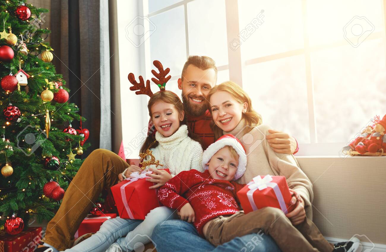 happy family parents and children open presents on Christmas morning - 132718850 happy family parents and children open presents on Christmas morning - 132718850