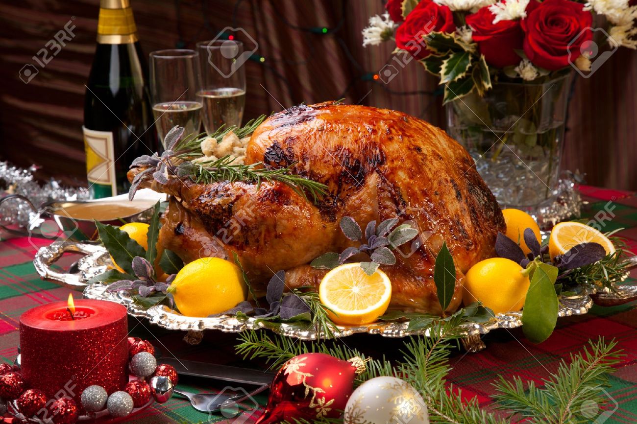 http://previews.123rf.com/images/evgenyb/evgenyb1010/evgenyb101000010/7897518-Garnished-roast-turkey-on-Christmas-decorated-table-with-candles--Stock-Photo.jpg